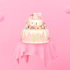 Birthday cake piled for cutting pink