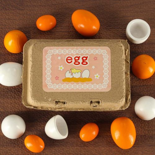 Toy egg with removable wooden yolk